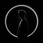 Dark silhouette in a circular frame with a bright rim light outline